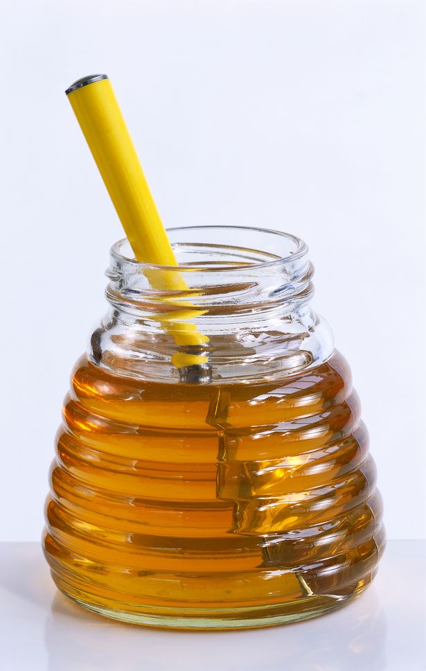 1_Glass-jar-with-honey-and-spoon-close-up.jpg