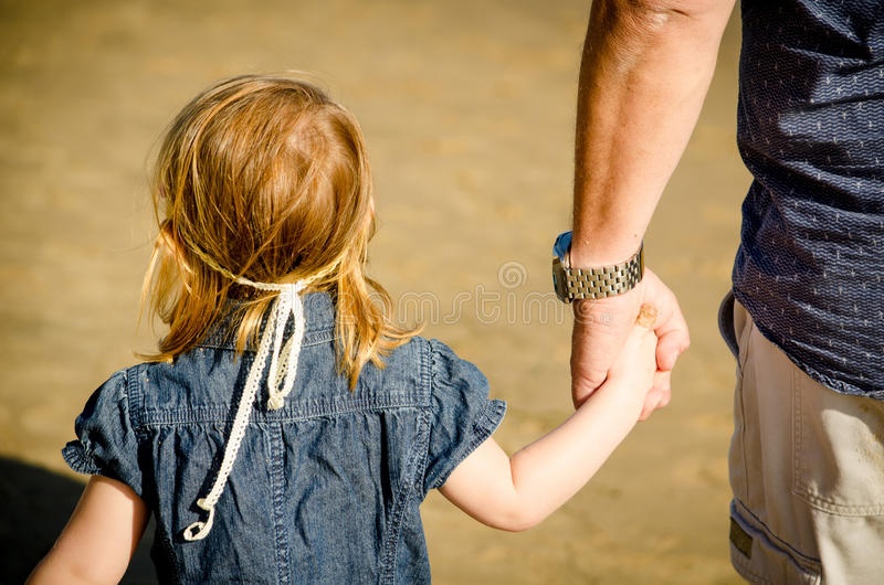 little-girl-holding-male-s-hand-could-be-her-father-could-be-pedophile-leading-her-away-60335846.jpg