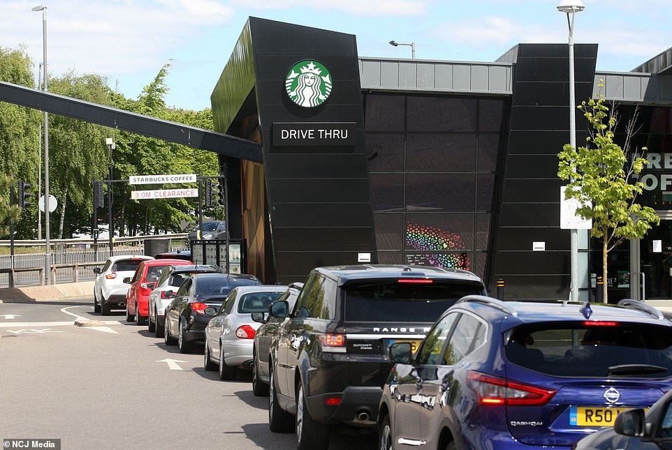 28396930-8320405-Cars_queue_at_the_Starbucks_drive_thru_at_the_Metro_Centre_in_Ga-a-10_1589477571315.jpg