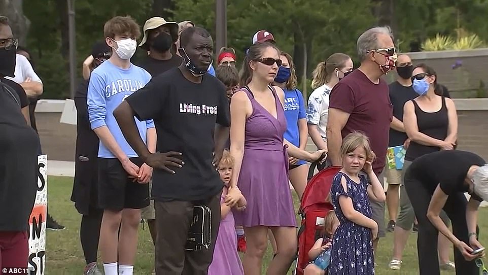 29337282-8397065-Walk_attendees_pictured_looking_on_at_the_feet_washing_ceremony-a-11_1591618965217.jpg