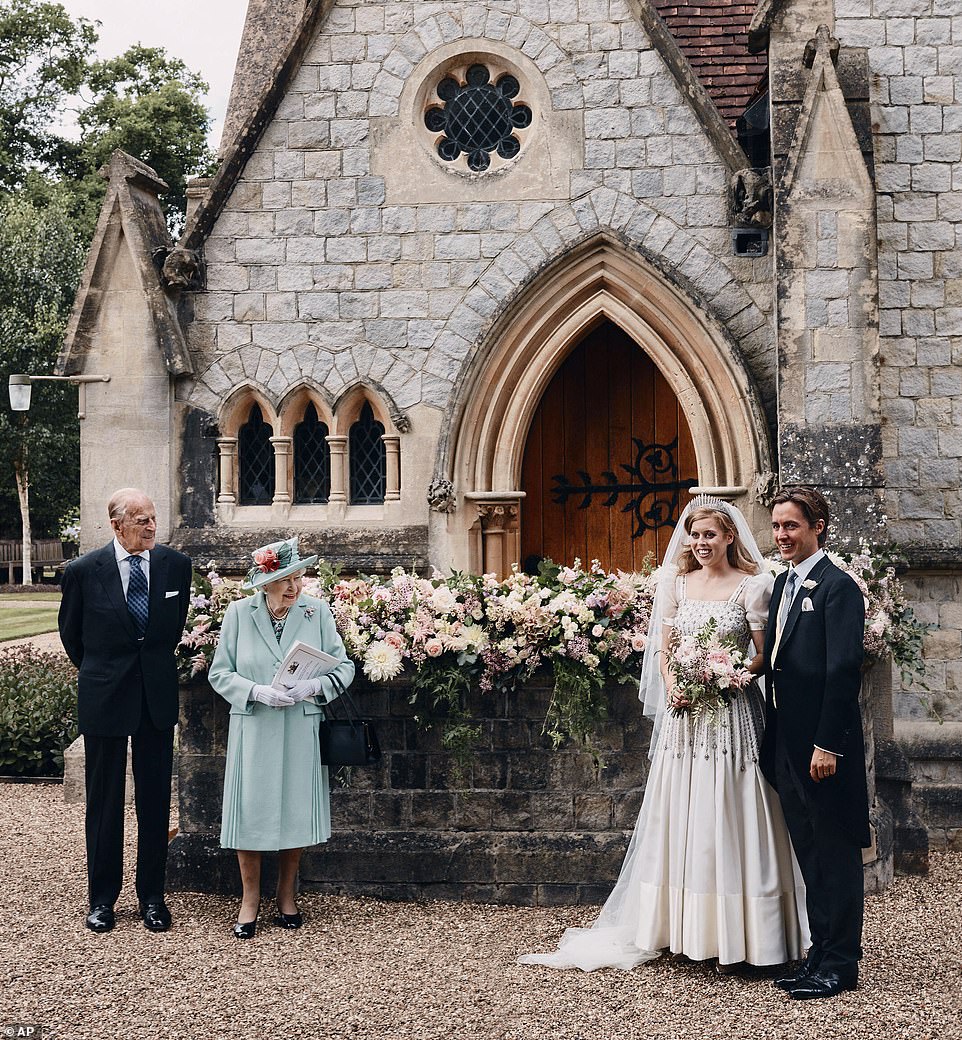 30923248-8537155-Queen_Elizabeth_II_and_Prince_Philip_stand_alongside_Princess_Be-m-2_1595110485912.jpg