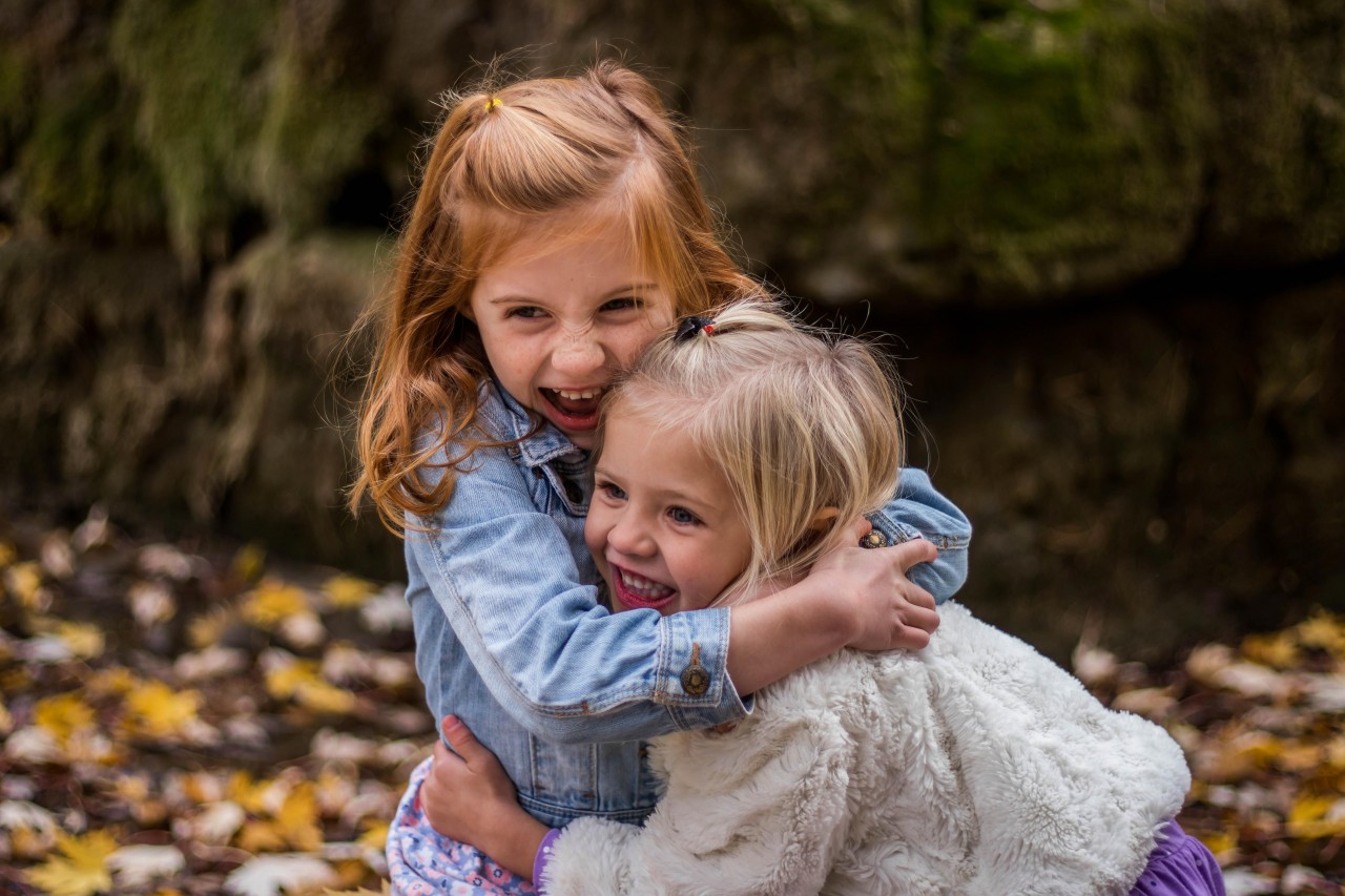 2-girls-hugging-each-other-outdoor-during-daytime-225017.jpg